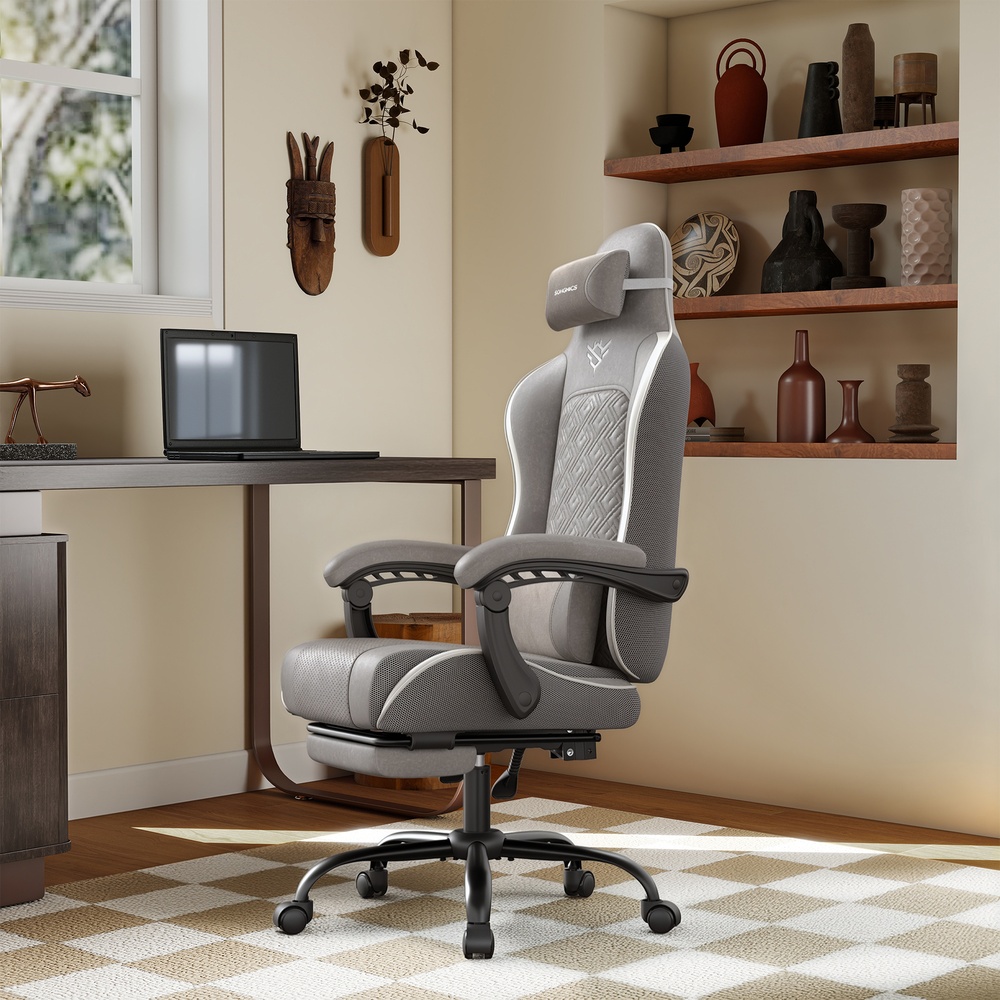 Ergonominen pelituoli jalkatukella ja jousityynyllä